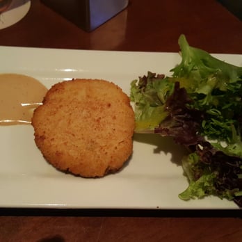 Seasons 52 - The ugly presentation of the lump crab cake.  Looked more like a fish cake to me lol lucky there was crab meat... - New American Near Me - Costa Mesa, California