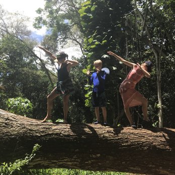 Kauai Hiking Tours - Jenny aka Tropical goddess/Hawaiian Wonder Woman (on left) makes dab and other dancing on the fallen tree with the kids - Hiking Near Me