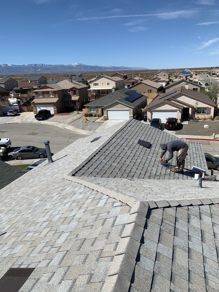 Slide of Ernestos Roofing