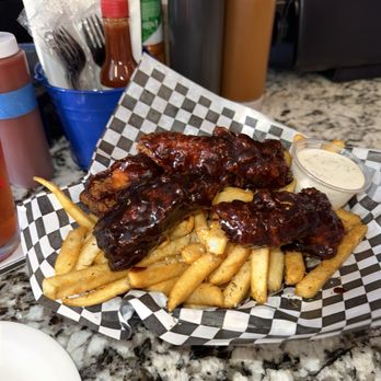 Boyle Heights Bar - Chicken Tenders tossed in BBQ with Rosemary Fries - Bars Near Me - Los Angeles, California