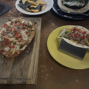 Stokes - Steak and potato flat bread, brisket taco, and the remains of a guac flight - Tex-Mex Near Me - Omaha, Nebraska Stokes - Steak and potato flat bread, brisket taco, and the remains of a guac flight - Tex-Mex Near Me - Omaha, Nebraska