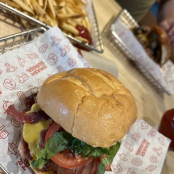 Smashburger - a burger and fries on a table - Burgers Near Me - Dresher, Pennsylvania Smashburger - a burger and fries on a table - Burgers Near Me - Dresher, Pennsylvania