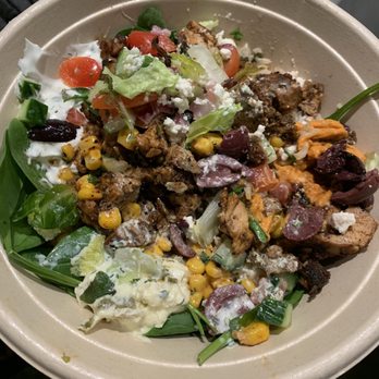 CAVA - Greens and grains bowl with chicken and lamb meatballs and a hodgepodge of veggies (sauces: feta and tzatziki) - Mediterranean Near Me - Austin, Texas