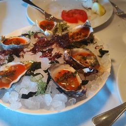 Oysters dressed with crispy quinoa- a very bad idea. Grit is not a desired texture for a raw oyster. Oysters dressed with crispy quinoa- a very bad idea. Grit is not a desired texture for a raw oyster.