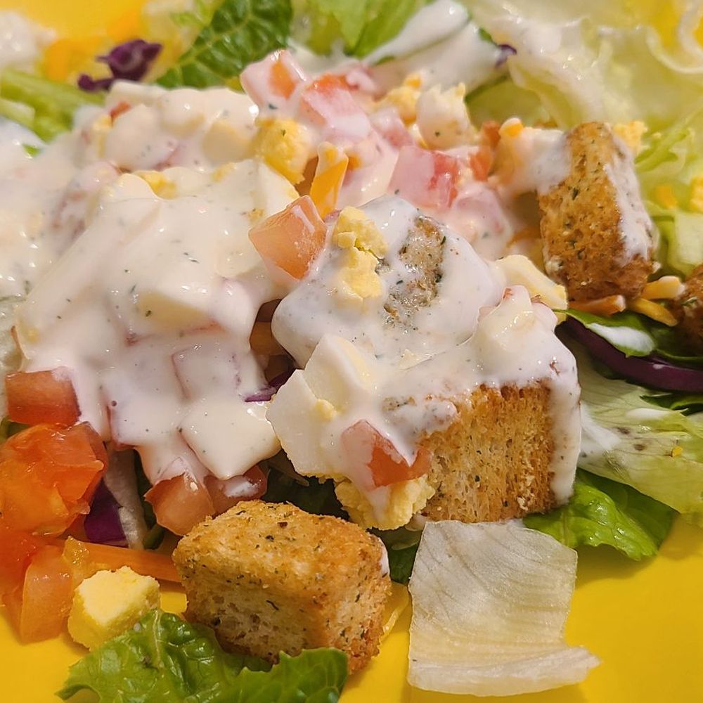 Village Inn - a plate of salad with croutons and dressing - Breakfast & Brunch Near Me - Loveland, Colorado Village Inn - a plate of salad with croutons and dressing - Breakfast & Brunch Near Me - Loveland, Colorado