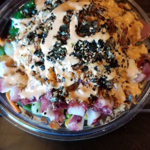 Photo of Honeyfish Poke - Rancho Cucamonga, CA, United States. Hawaiian tuna, salmon, octopus in spicy mayo on a bed of kale and salad