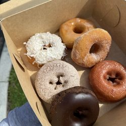 Turner Donut Shop - From top left to bottom  Coconut, cinnamon, double chocolate From top right to bottom Glazed Sugar Cherry