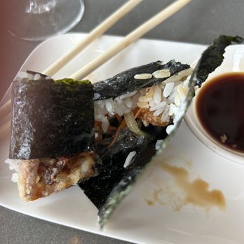 Hando - Crab handrolls, loosley wrapped with a flap on the bottom made it difficult to eat and messy - Sushi Bars Near Me - Houston, Texas