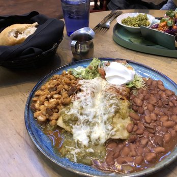 La Plazuela - Chicken enchiladas with Christmas (half red, half green) sauce, pinto beans, pozole, sopapillas and honey - New American Near Me - Santa Fe, New Mexico