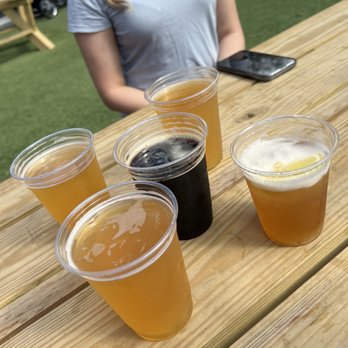 The Yardery - Mango beer, s'mores beer in the middle, and a bourbon cocktail to the right - American Near Me - Sanford, Florida The Yardery - Mango beer, s'mores beer in the middle, and a bourbon cocktail to the right - American Near Me - Sanford, Florida