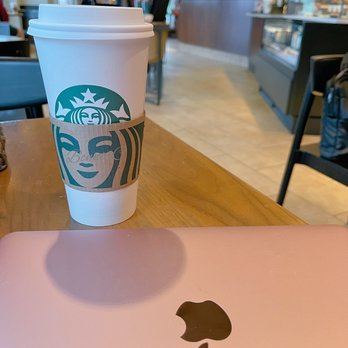 Starbucks - a cup of coffee and a laptop on a table - Coffee & Tea Near Me - Markham, Ontario Starbucks - a cup of coffee and a laptop on a table - Coffee & Tea Near Me - Markham, Ontario