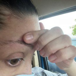 My totally butchered eyebrow on the right.