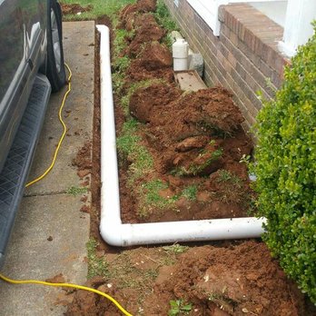 Rising Waters Basement Systems - Downspout extension this one has some length on it. But it's always best to get the water as far away from the home as possible. - Damage Restoration Near Me Rising Waters Basement Systems - Downspout extension this one has some length on it. But it's always best to get the water as far away from the home as possible. - Damage Restoration Near Me
