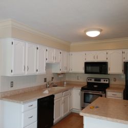 Hermoza Home Beautification - Painted white cabinets.