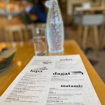 Bonifacio - a menu on a wooden table - Filipino Near Me - Columbus, Ohio Bonifacio - a menu on a wooden table - Filipino Near Me - Columbus, Ohio