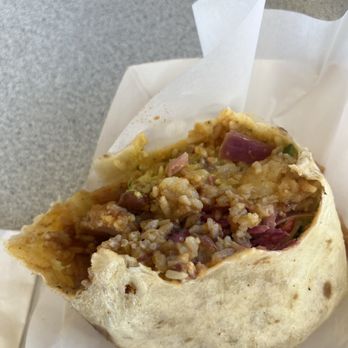 Latin Fuego - Bacon Breakfast Burrito, half eaten. This thing is a monster!! - Breakfast & Brunch Near Me - Rahway, New Jersey Latin Fuego - Bacon Breakfast Burrito, half eaten. This thing is a monster!! - Breakfast & Brunch Near Me - Rahway, New Jersey