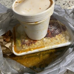a plastic container with a sauce in it