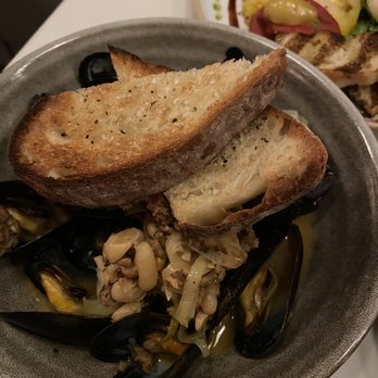 Bargello - PEI MUSSELS  18 Tarbais Beans, Italian Sausage, Leeks, Roasted Garlic, White Wine & Butter, Rustic Bread - Mediterranean Near Me - Asheville, North Carolina