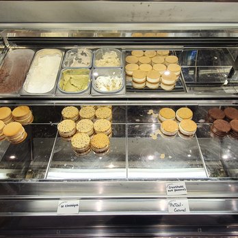 Frisquet - a display case with a variety of pastries - Ice Cream & Frozen Yogurt Near Me - Montreal, Quebec