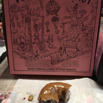 Voodoo Doughnut - Their iconic box with the blueberry donut + caramel glaze. - Donuts Near Me - Austin, Texas Voodoo Doughnut - Their iconic box with the blueberry donut + caramel glaze. - Donuts Near Me - Austin, Texas