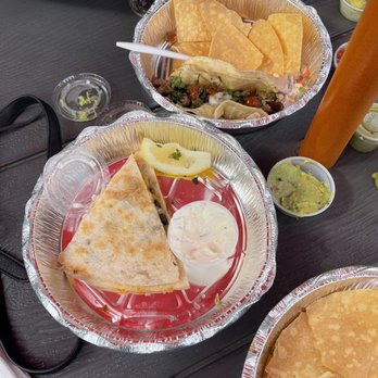 Quincho's - a plate of quesadillas and a plate of quesadillas - American Near Me - Montauk, New York