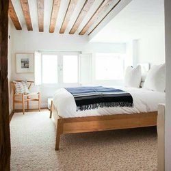 Adrienne's Decor - Add a rustic yet cozy environment by creating wood ceiling beams.