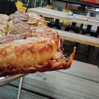 Rickety Cricket Brewing - Cheesy crispy tasty corner crust! - Pizza Near Me - Kingman, Arizona