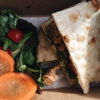 The Pine Bar - Chicken Tikka Masandwich in to-go box. Nibbling in the car on the way home on game day #GoDawgs - Bars Near Me - Athens, Georgia