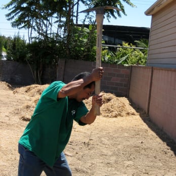 Good Soil Industries - a man holding a baseball bat - Landscaping Near Me - Bellflower, California Good Soil Industries - a man holding a baseball bat - Landscaping Near Me - Bellflower, California