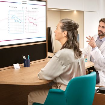 Miracle-Ear Center - Miracle-Ear hearing aid center experience: woman checking her audiogram with hearing care specialist - Audiologist Near Me - Kerrville, Texas