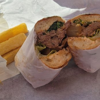 Paseo - Carribean roast sandwich with side order of Yucca fries. - Caribbean Near Me - Seattle, Washington Paseo - Carribean roast sandwich with side order of Yucca fries. - Caribbean Near Me - Seattle, Washington