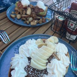 Breakfast at Victoria's AMI - Avocado Toast and Chocolate Chip Pancakes with banana