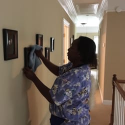 My Amazing Maid - Dusting a picture correctly means using one hand to hold the frame and the other to dust