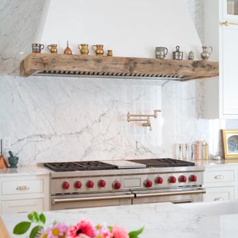 The Tile & Stone Design Center - a kitchen with white cabinets and marble countertops - General Contractors Near Me - Ashland, Oregon The Tile & Stone Design Center - a kitchen with white cabinets and marble countertops - General Contractors Near Me - Ashland, Oregon