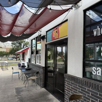 Twin Isle - Store front/ outside sitting area - Caribbean Near Me - Austin, Texas Twin Isle - Store front/ outside sitting area - Caribbean Near Me - Austin, Texas