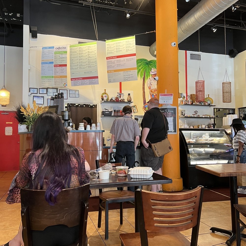 Cafecito - people sitting at tables in a restaurant - Cuban Near Me - Chicago, Illinois