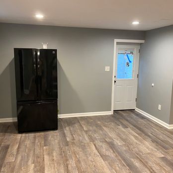 Bear Construction Group - Basement finish with new LVP flooring , new staircase , new ceiling lights and new paint. - General Contractors Near Me - Dulles, Virginia