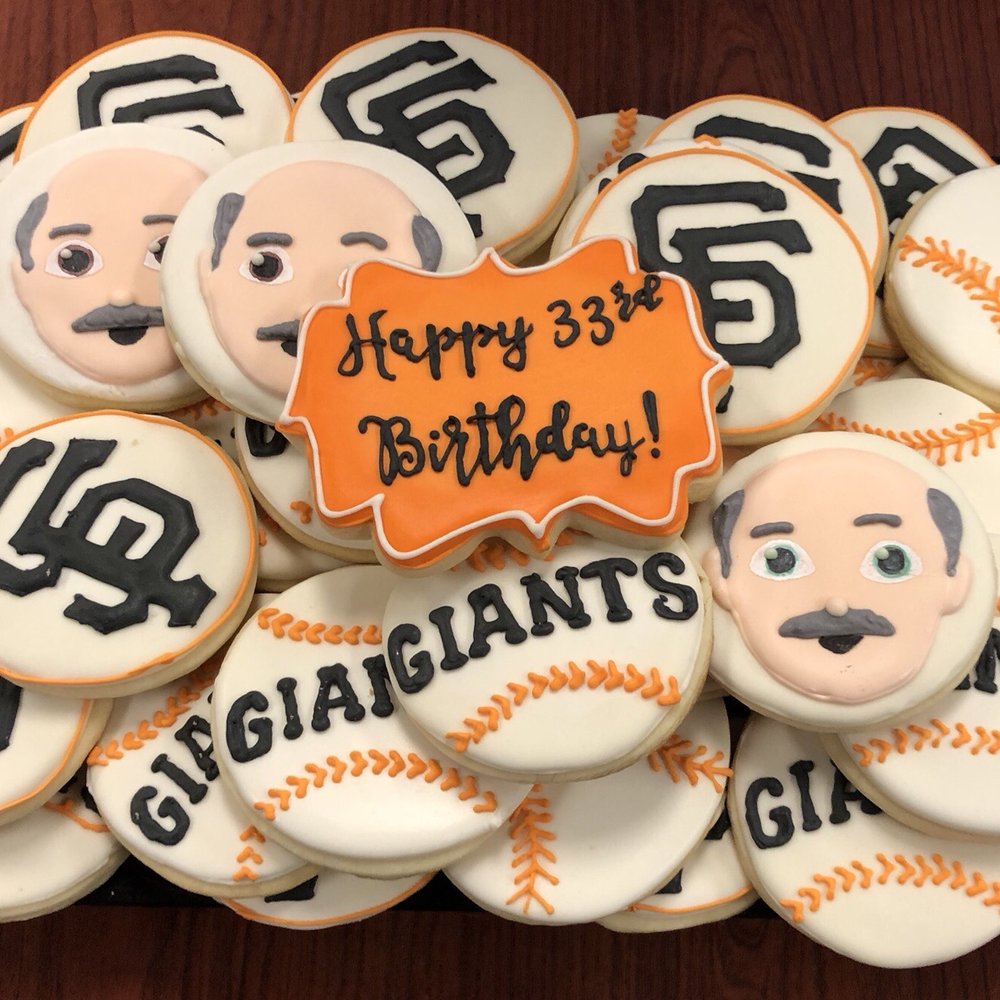 a plate of decorated baseball cookies a plate of decorated baseball cookies