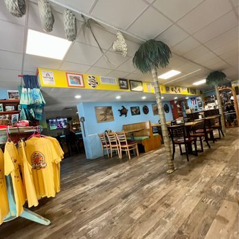 The Tiny Turtle - Inside dining area. Bar on the left and more tables (not shown) towards the right. You can sit down or order to-go at the hostess stand. - Caribbean Near Me - Cocoa Beach, Florida The Tiny Turtle - Inside dining area. Bar on the left and more tables (not shown) towards the right. You can sit down or order to-go at the hostess stand. - Caribbean Near Me - Cocoa Beach, Florida