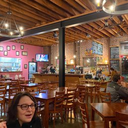 people sitting at tables in a restaurant people sitting at tables in a restaurant