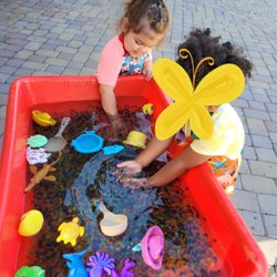 Colorful Beginnings Infant Care - Sensory water table outdoor fun.