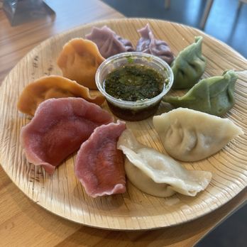 Sun's Kitchen - Dumpling Flight with Cilantro Garlic Sauce - Chinese Near Me - Charlotte, North Carolina Sun's Kitchen - Dumpling Flight with Cilantro Garlic Sauce - Chinese Near Me - Charlotte, North Carolina