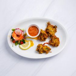 Masala - 1- VEG PAKORA               59:-
En blandning av olika grönsaker, friterade med våra speciella kryddor och linsmjöl