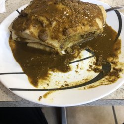 Kori's Roti Stop - Large goat roti with gravy on top