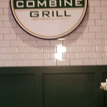 The Combine Bar & Grill - a counter with a vase of flowers - Bars Near Me - Cambridge, Illinois