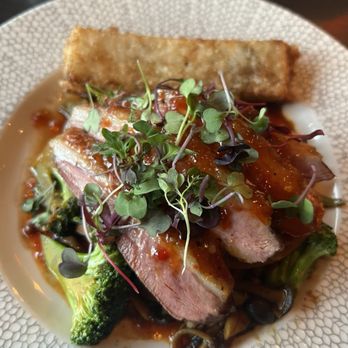 Heritage - SZECHUAN GLAZED DUCK BREAST  crispy rice cake, honshimeji mushrooms, bok choy, carrots, broccoli, hoisin ginger sauce - New American Near Me - Richmond, Virginia