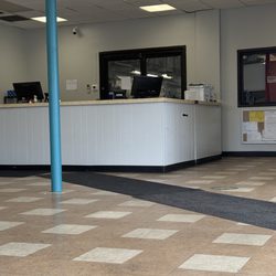 Mavis Discount Tire - Front desk. Kinda gross floors and chairs.