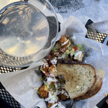 Sutherland's Food & Spirits - a sandwich and a glass of water - Burgers Near Me - Chicago, Illinois Sutherland's Food & Spirits - a sandwich and a glass of water - Burgers Near Me - Chicago, Illinois
