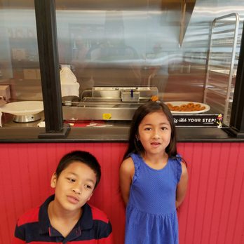 Duck Donuts - Donut conveyor belt in the background - Donuts Near Me - Hershey, Pennsylvania