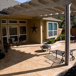 Creative Concrete - Stamped concrete patio with aluminum pergola by Creative Concrete ®.